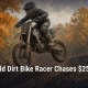 Fostoria News Young dirt bike rider in mid-air during race in autumn setting.